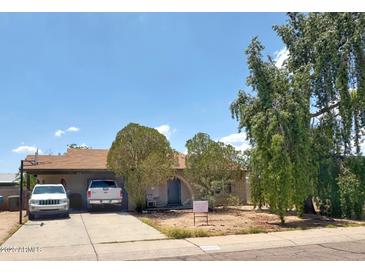 Charming single-story home featuring a welcoming entrance and well-maintained landscaping at 3531 W Libby St, Glendale, AZ 85308