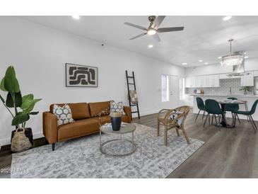 Bright living room with modern decor, hardwood floors, and contemporary furniture at 8020 E Thomas Rd # 313, Scottsdale, AZ 85251