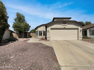 Charming single-story home featuring a well-maintained yard and a two-car garage at 8831 N 63Rd Dr, Glendale, AZ 85302