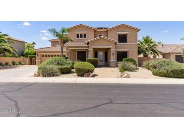 Beautiful two-story home with desert landscaping and a well-maintained front yard at 18432 W Port Royale Ln, Surprise, AZ 85388