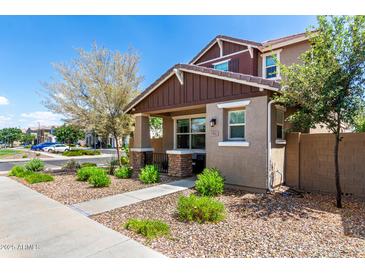 Charming two-story home with a welcoming front porch and well-maintained landscaping at 1882 S Jesse Pl, Chandler, AZ 85286