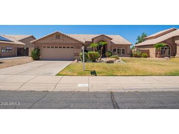 Charming single-story home with well-manicured lawn and inviting curb appeal at 251 E Arabian Dr, Gilbert, AZ 85296