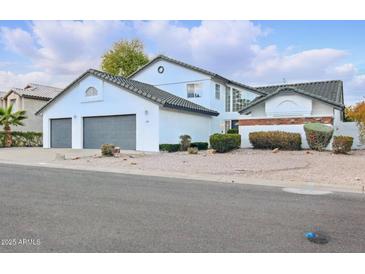 A charming two-story home with a well-manicured yard and a two-car garage at 5742 W Shannon St, Chandler, AZ 85226