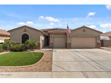 Charming single-story home with a well-manicured lawn and a spacious two-car garage, perfect for comfortable living at 10033 W Jessie Ln, Peoria, AZ 85383