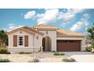 Charming single-story home showcasing a tile roof, desert landscaping, and a welcoming two-car garage at 16515 W Avenida Del Sol --, Surprise, AZ 85387
