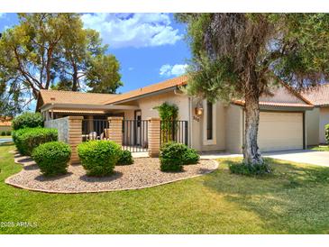 Charming single-story home featuring a well-maintained yard and a private front patio at 365 Leisure World --, Mesa, AZ 85206