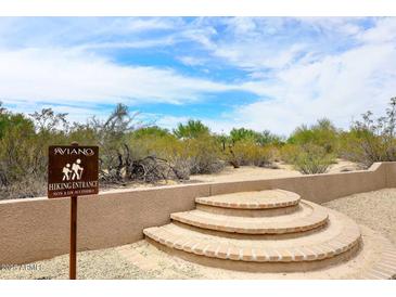 Aviano hiking entrance with natural desert landscaping and a beautiful blue sky at 3931 E Crest Ln, Phoenix, AZ 85050