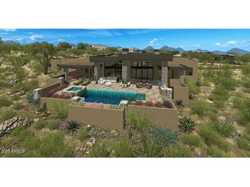 Upscale modern home featuring an in-ground pool, spa, patio area, and desert landscaping at 39878 N 105Th Way, Scottsdale, AZ 85262