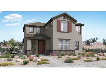 Charming two-story home featuring a mix of stucco and stone, complemented by desert landscaping at 14669 W Sand Hills Rd, Surprise, AZ 85387