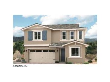 Charming two-story home with a neutral color scheme, light trim, and decorative shutters at 16968 W Winston Dr, Goodyear, AZ 85338