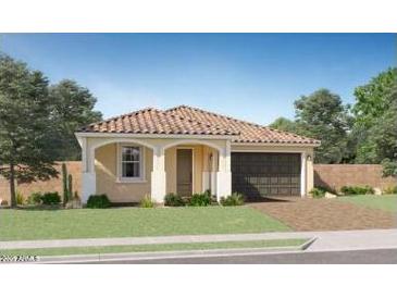 Charming single-story home with a tile roof, well-manicured lawn, and a two-car garage at 20901 S 231St Way, Queen Creek, AZ 85142
