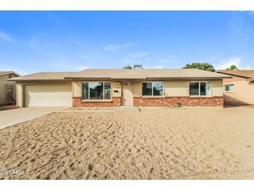 Charming single-story home with desert landscaping and a two-car garage at 2922 S Cottonwood Dr, Tempe, AZ 85282