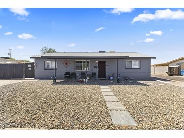Charming single-story home with neutral paint and rock landscaping for low maintenance at 3307 W Willow Ave, Phoenix, AZ 85029