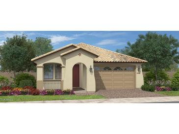 Charming single-story home featuring a tile roof, arched entryway, two-car garage and low maintenance desert landscaping at 35017 N Sacramento Wash Rd, San Tan Valley, AZ 85144
