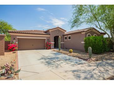 Charming single story home featuring low maintenance desert landscaping and attached two car garage at 1225 S 160Th Ln, Goodyear, AZ 85338
