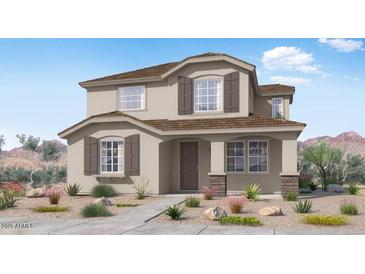 Charming two-story home with neutral paint, brown shutters, and low-maintenance landscaping at 14663 W Sand Hills Rd, Surprise, AZ 85387