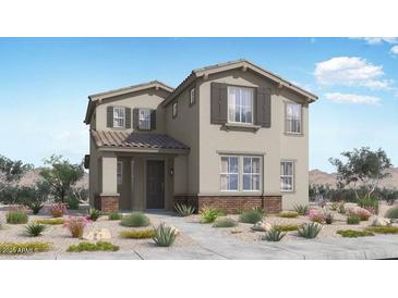 Charming two-story home with neutral exterior, stylish shutters, and professionally landscaped front yard at 14665 W Sand Hills Rd, Surprise, AZ 85387