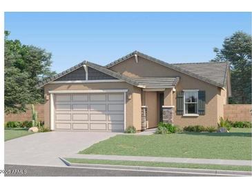 Charming single-story home with a well-maintained lawn and a two-car garage, perfect for suburban living at 3139 E Barrel Race Rd, San Tan Valley, AZ 85140