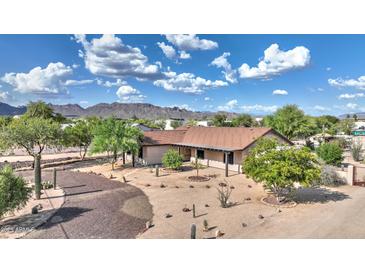 Charming single-story home with desert landscaping and mountain views at 833 N 110Th St, Mesa, AZ 85207