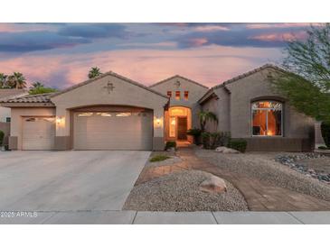 Charming single-story home with a desert-landscaped front yard and a spacious three-car garage at 1963 E Monterey St, Chandler, AZ 85225
