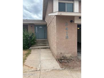 Charming home featuring a quaint front door and inviting curb appeal in a quiet neighborhood at 2419 W Crocus Dr, Phoenix, AZ 85023