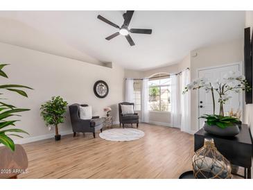 Comfortable living room featuring neutral colors and a ceiling fan for maximum comfort at 8103 E Dartmouth St, Mesa, AZ 85207