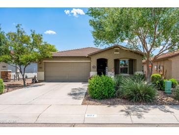 Charming single-story home with desert landscaping, a two-car garage, and a welcoming front porch at 907 E Kelsi Ave, San Tan Valley, AZ 85140