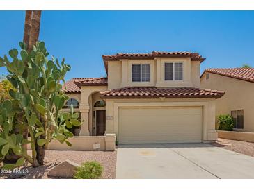 Two-story home with a two-car garage, tile roof, and desert landscaping at 9649 S 51 St St, Phoenix, AZ 85044