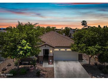 Charming single-story home showcasing a tile roof and well-maintained landscaping at 1344 N Claiborne --, Mesa, AZ 85205