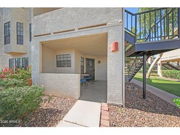 Cozy covered patio with a small table and chairs offers a relaxing outdoor space at 2333 E Southern Ave # 1049, Tempe, AZ 85282