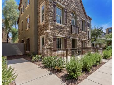 Stunning two-story home featuring stone accents, dark shutters, and a well-maintained front yard at 2636 S Bahama Dr, Gilbert, AZ 85295