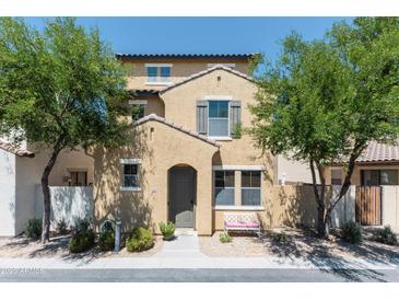 Charming two-story home featuring a welcoming front porch and well-maintained landscaping with mature trees at 451 S Hawes Rd # 53, Mesa, AZ 85208