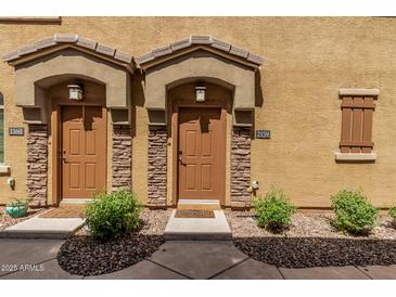 Inviting front doors with covered entrances and desert landscaping offer curb appeal at 1350 S Greenfield Rd # 2159, Mesa, AZ 85206