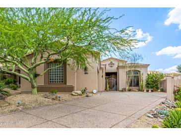 Charming home featuring desert landscaping, mature tree, and tiled roof at 15953 N 111Th Way, Scottsdale, AZ 85255