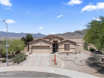 Charming single-story home featuring a desert landscape, attached garage, and beautiful mountain views at 16404 S 18Th Dr, Phoenix, AZ 85045