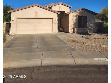 Charming single-story home with a two-car garage, desert landscaping, and a welcoming entryway at 16404 S 18Th Dr, Phoenix, AZ 85045