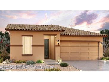Charming single-story home featuring a tile roof, neutral stucco, and a two-car garage at 24160 W Gibson Ln, Buckeye, AZ 85326