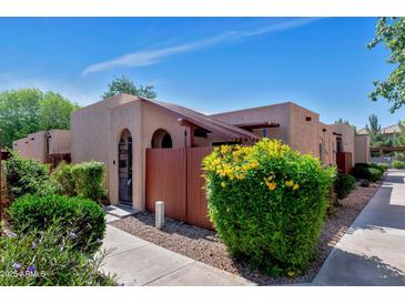 Charming single-story home with well-maintained landscaping and a private front patio at 1066 E Pueblo Rd, Phoenix, AZ 85020