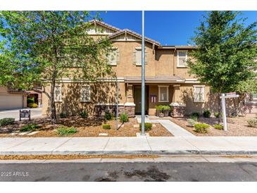 Charming two-story home with inviting curb appeal, landscaping, and decorative stone accents at 1528 N Balboa --, Mesa, AZ 85205