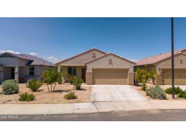 Charming single-story home featuring desert landscaping and a two-car garage at 16824 W Alice Ave, Waddell, AZ 85355