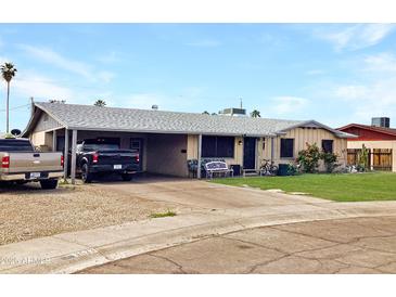 Charming single-story home with a spacious driveway and low maintenance landscaping at 3627 W Hayward Ave, Phoenix, AZ 85051
