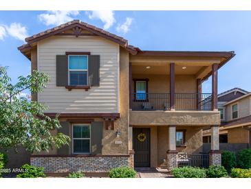 Charming two-story home with a covered porch, balcony, and landscaped front yard at 4173 E Jones St, Gilbert, AZ 85295