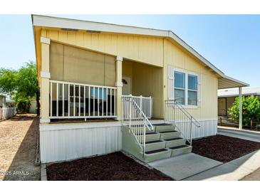 Inviting porch with screened walls and steps leading to the home's entryway at 8832 E Pueblo Ave # 71, Mesa, AZ 85208