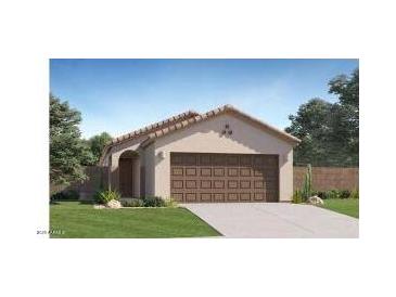 Charming single-story home with a neutral color palette, a two-car garage, and a well-maintained front yard at 12013 E Primrose Ln, Florence, AZ 85132