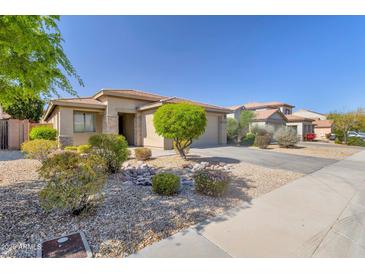 Charming single-story home with desert landscaping, stone accents, and a well-maintained front yard in a quiet neighborhood at 29356 N 67Th Ave, Peoria, AZ 85383