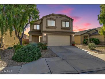 Charming two-story home with a two car garage, desert landscaping, and a cozy front porch at 3049 W Santa Cruz Ave, San Tan Valley, AZ 85144