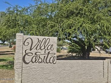 Entrance sign to the Villa Easita neighborhood with mature tree at 3807 W Mitchell Dr, Phoenix, AZ 85019