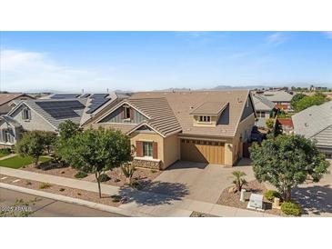 Inviting single-story home featuring a manicured front yard and attached two car garage at 4426 E Leroy St, Gilbert, AZ 85295