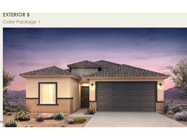 Charming single-story home with a two-car garage and desert landscaping at 5029 S 252Nd Ave, Buckeye, AZ 85326