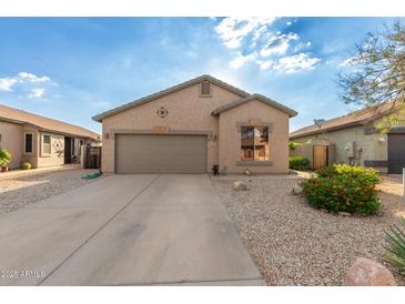 Charming single-story home featuring a two-car garage, low maintenance desert landscaping, and a neutral color scheme at 6520 E Hacienda La Noria Ln, Gold Canyon, AZ 85118